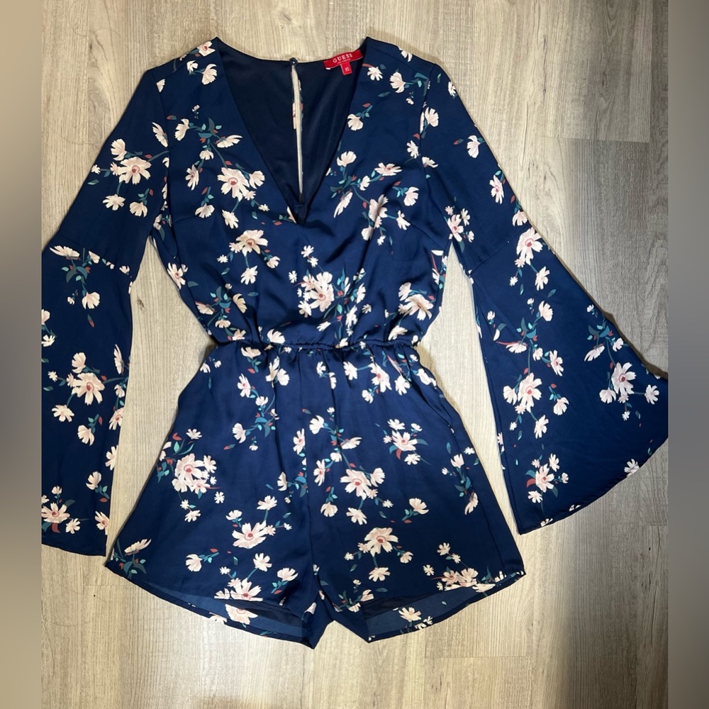 GUESS - XS Navy blue floral romper with long flared sleeves for a feminine feel